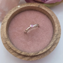 Silver stacking pebble ring with pink sapphire. Hammer finish. Size K