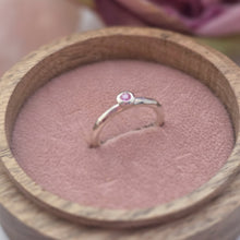 Silver stacking pebble ring with pink sapphire. Hammer finish. Size K