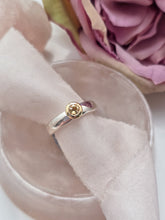Citrine with 9ct yellow gold setting and silver band