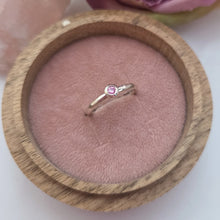 Silver stacking pebble ring with pink sapphire. Hammer finish. Size K